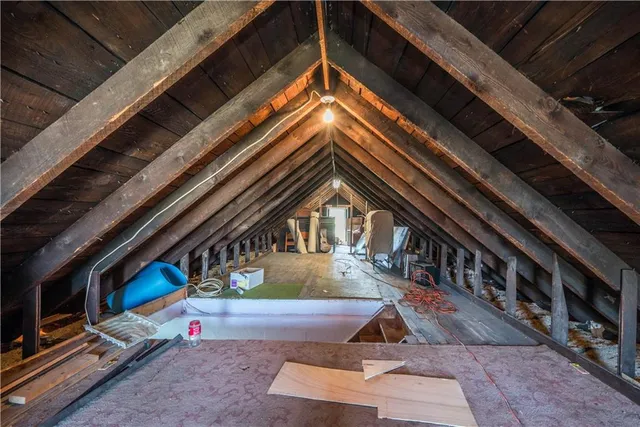a bathroom with a sink vanity mirror and toilet