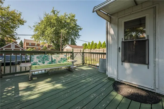 a view of a house with wooden deck