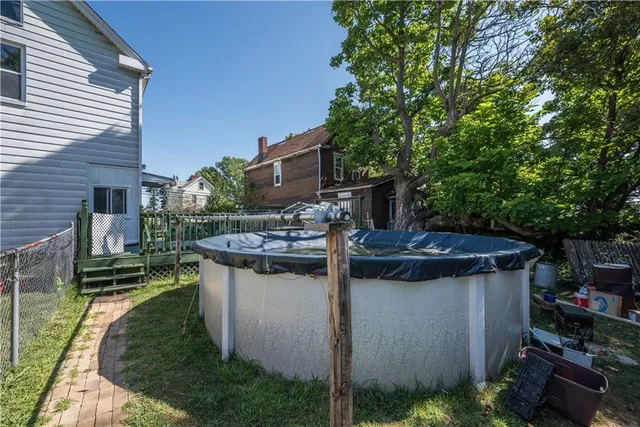 a view of house with backyard and entertaining space