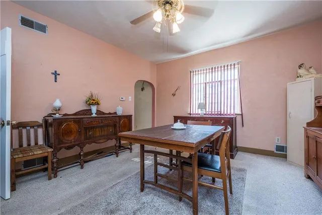 a dining room with furniture and window