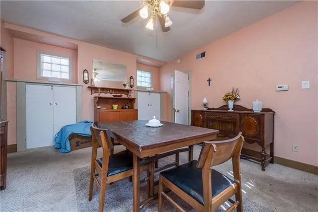 a dining room with furniture and window