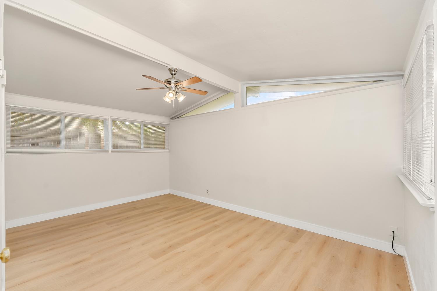 317 Brookwood Road Roseville, CA 95678 - Photo 15 of 36 a view of empty room with wooden floor and fan