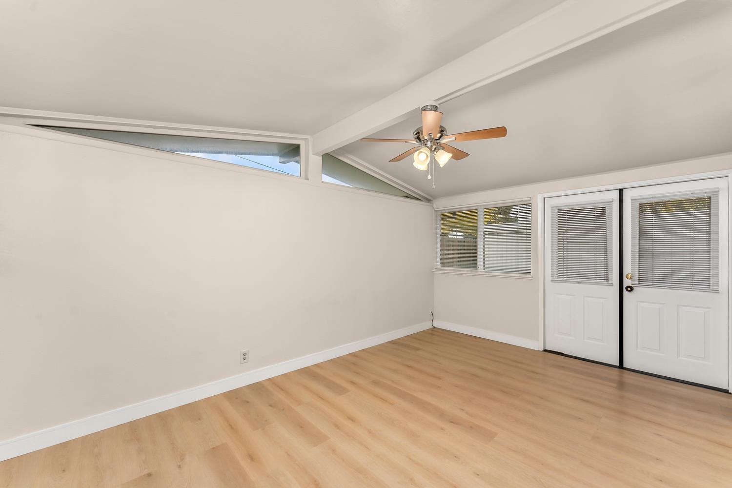 317 Brookwood Road Roseville, CA 95678 - Photo 18 of 36 a view of empty room with wooden floor and fan