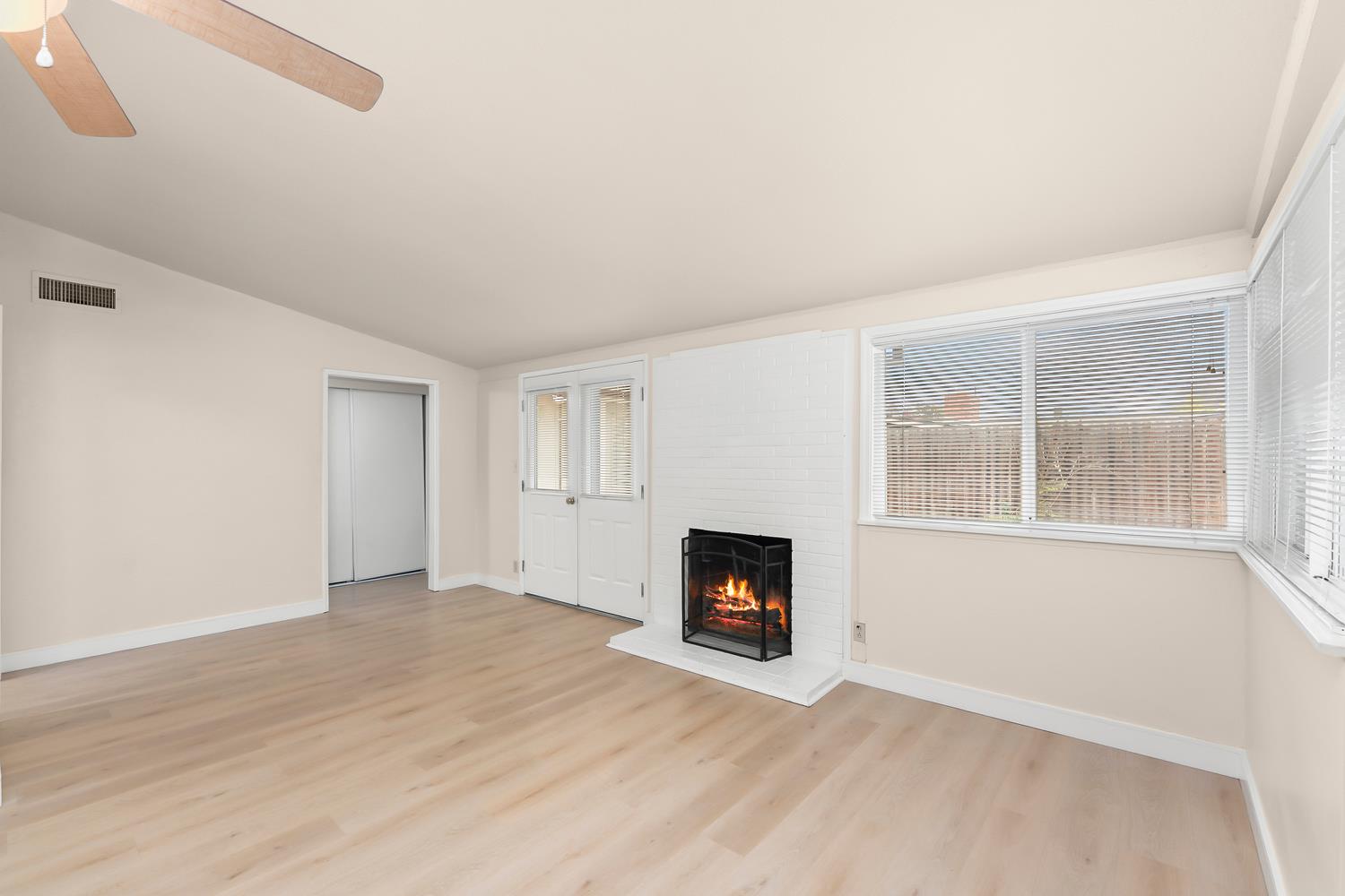 317 Brookwood Road Roseville, CA 95678 - Photo 5 of 36 an empty room with windows and fireplace