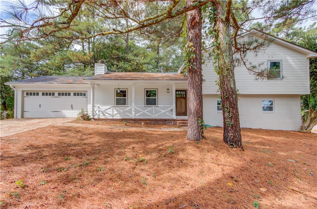 1351 Monfort Road Lawrenceville, GA 30046 - Photo 1 of 1 a front view of house with yard