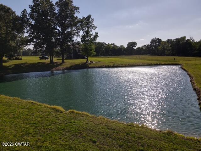 648 Old Dyersburg Road Dyer, TN 38330 - Photo 23 of 24 a view of a lake with houses in the background