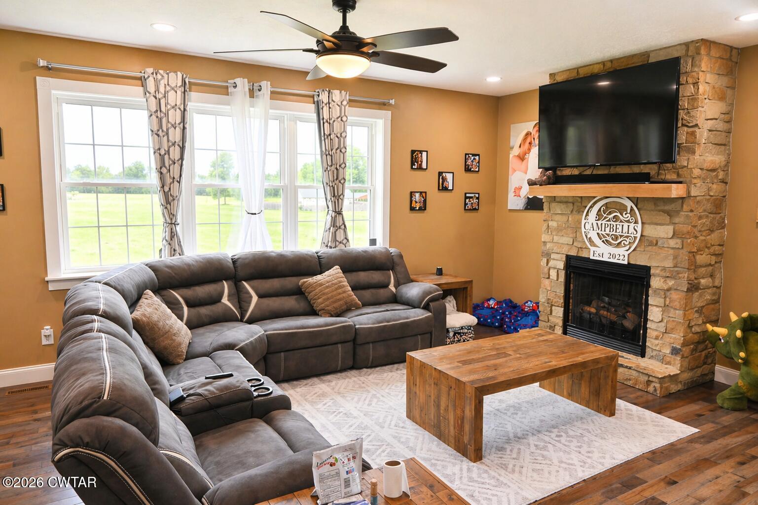 648 Old Dyersburg Road Dyer, TN 38330 - Photo 3 of 20 a living room with furniture a flat screen tv and a fireplace