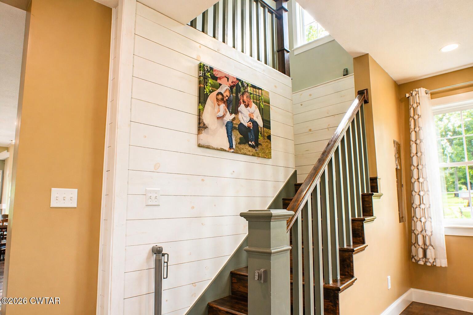 648 Old Dyersburg Road Dyer, TN 38330 - Photo 8 of 20 a view of staircase with wooden floor and a window