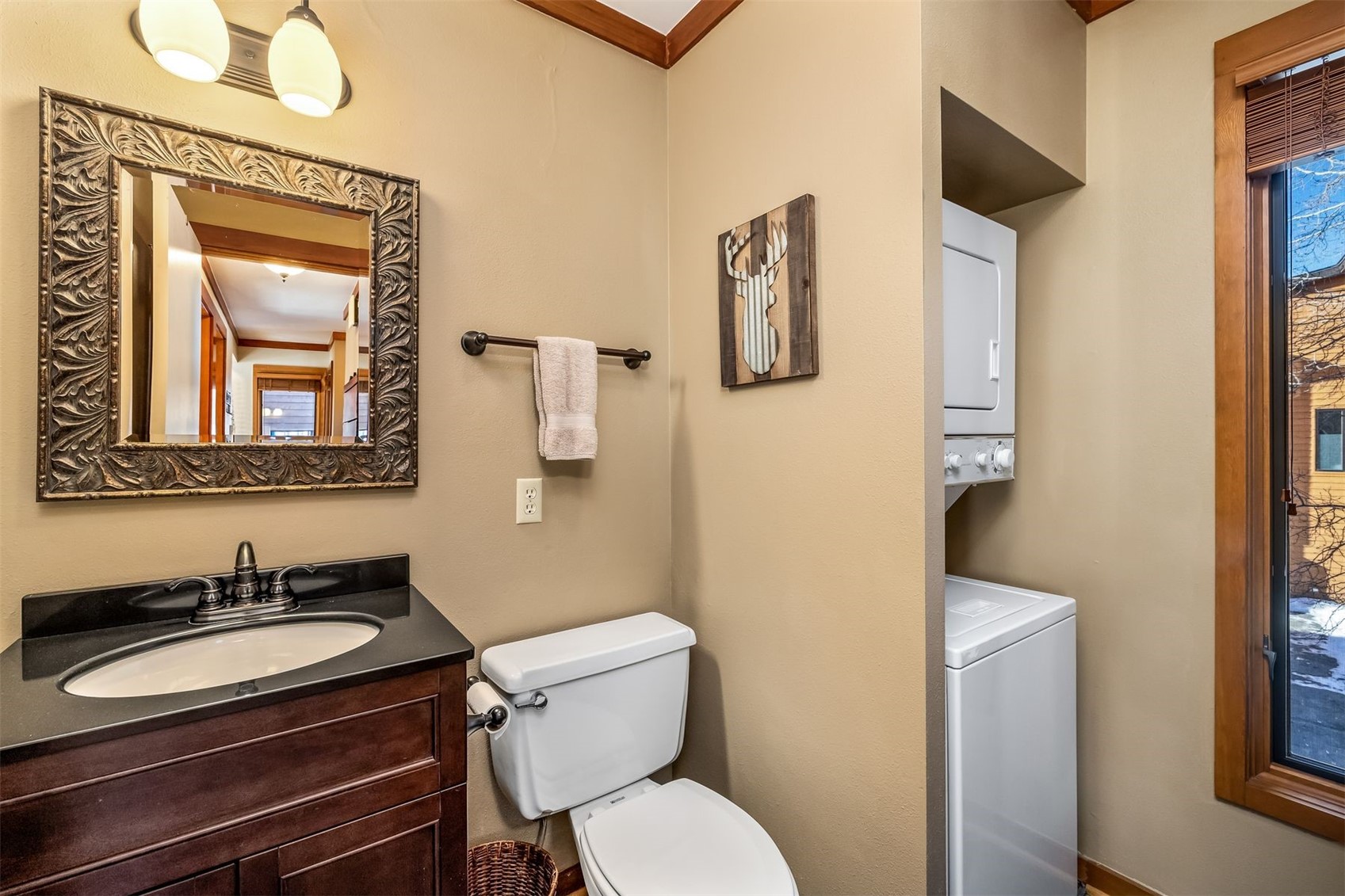 410 Tennis Club Road, Unit 1317 Keystone, CO 80435 - Photo 9 of 42 a bathroom with a toilet sink and mirror