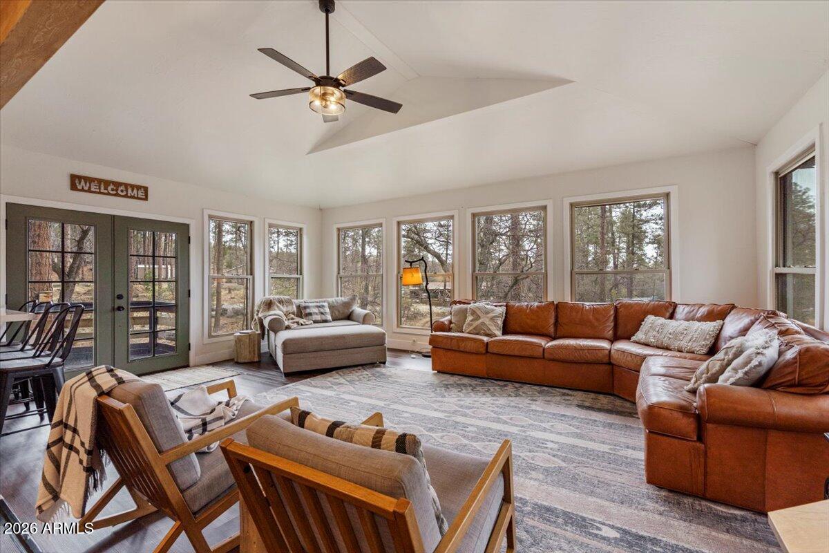 5979 Dearing Road Prescott, AZ 86305 - Photo 18 of 48 a living room with furniture a ceiling fan a bookshelf and a window