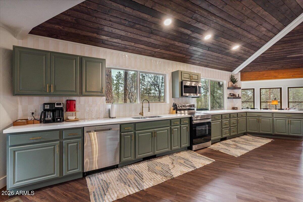 5979 Dearing Road Prescott, AZ 86305 - Photo 22 of 48 a kitchen with sink cabinets and wooden floor