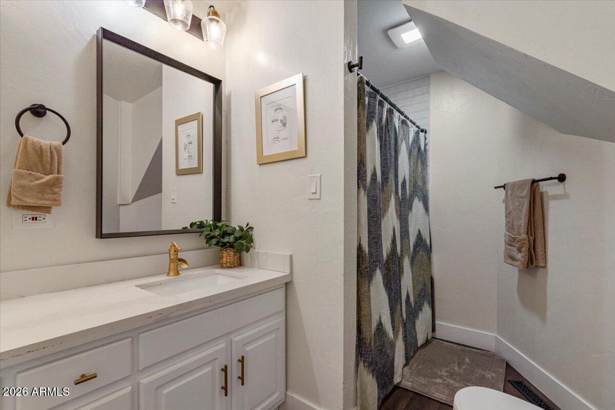 5979 Dearing Road Prescott, AZ 86305 - Photo 34 of 48 a bathroom with a sink a mirror and shower