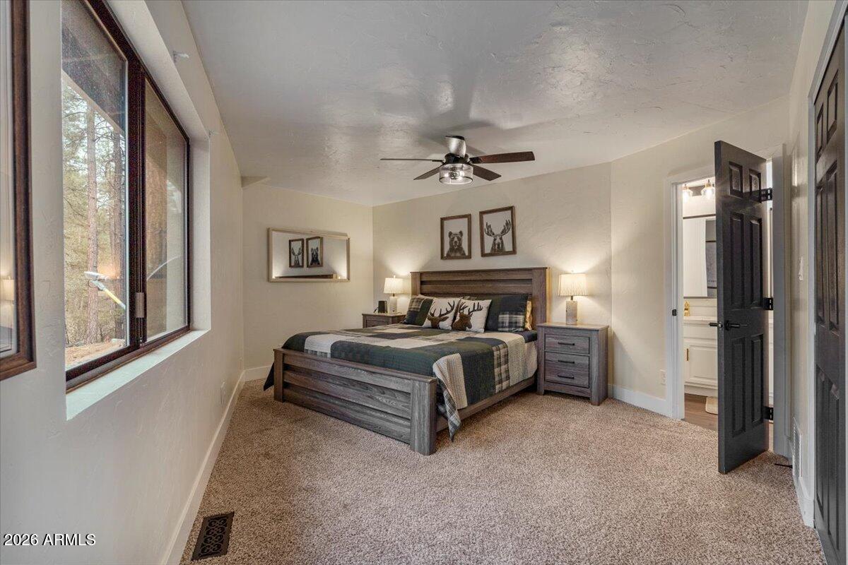 5979 Dearing Road Prescott, AZ 86305 - Photo 37 of 48 a living room with furniture and a chandelier