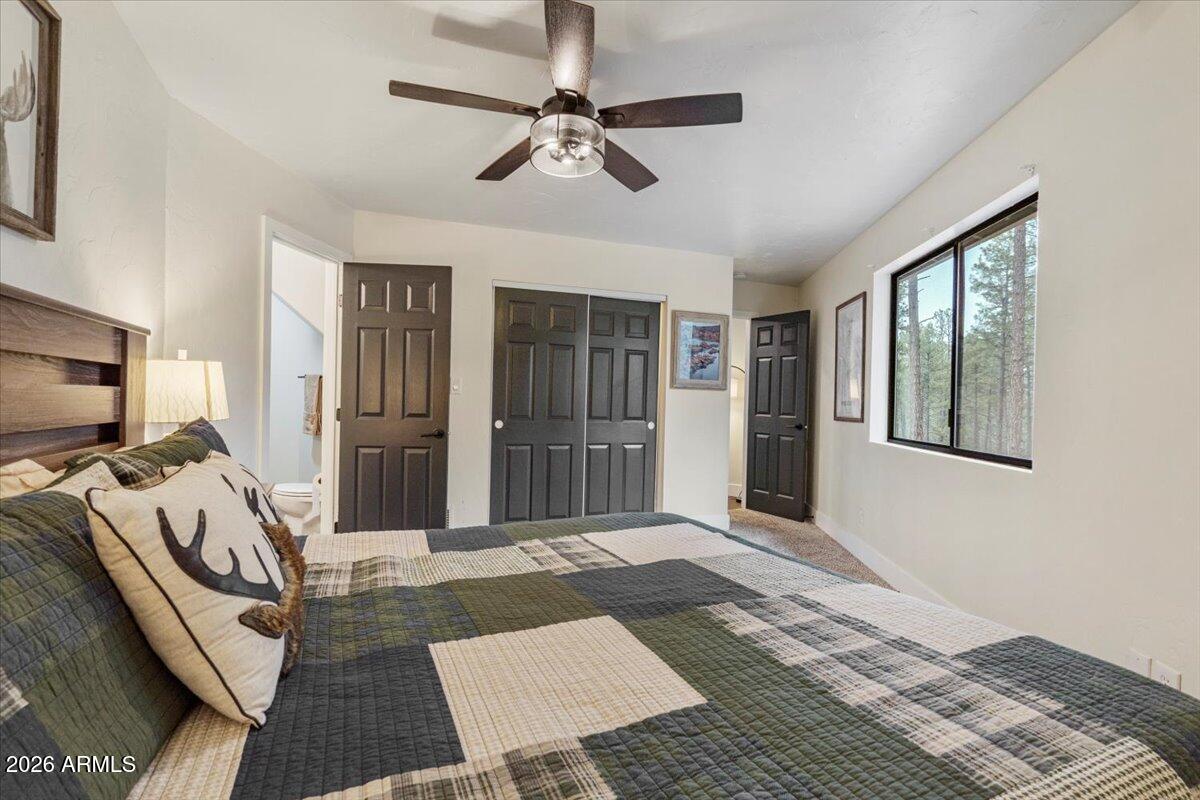 5979 Dearing Road Prescott, AZ 86305 - Photo 39 of 48 a bed sitting in a room next to a window