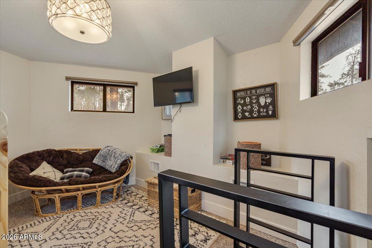 5979 Dearing Road Prescott, AZ 86305 - Photo 41 of 48 a living room with furniture a flat screen tv and a window