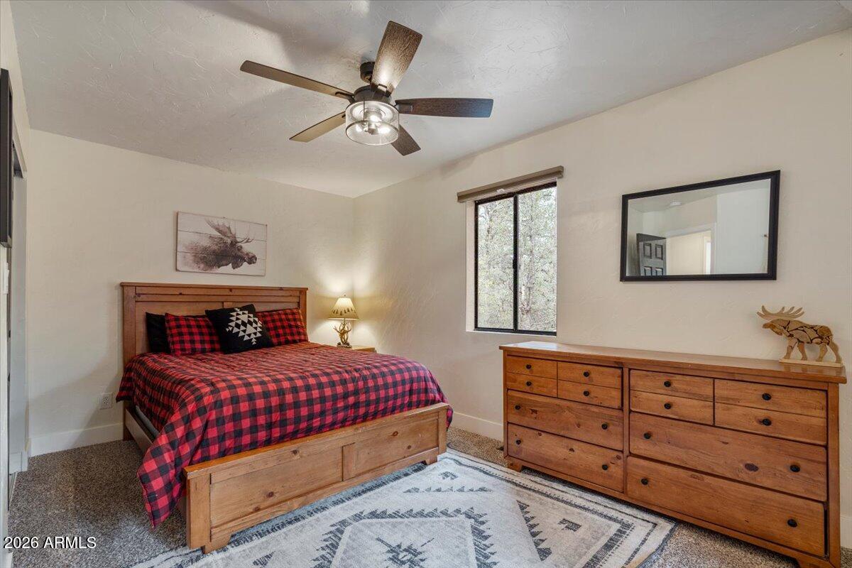 5979 Dearing Road Prescott, AZ 86305 - Photo 44 of 48 a bedroom with a bed and a dresser