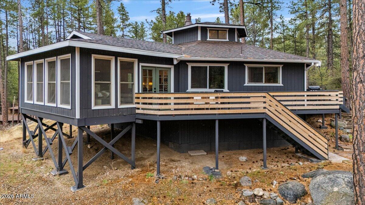 5979 Dearing Road Prescott, AZ 86305 - Photo 8 of 48 a view of a house with a balcony and chairs