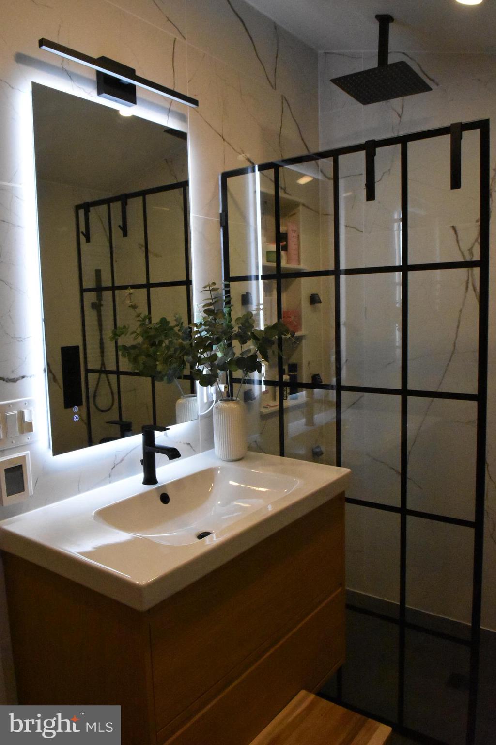 28 Delaware Avenue Ewing, NJ 08628 - Photo 21 of 46 a bathroom with a sink and a mirror