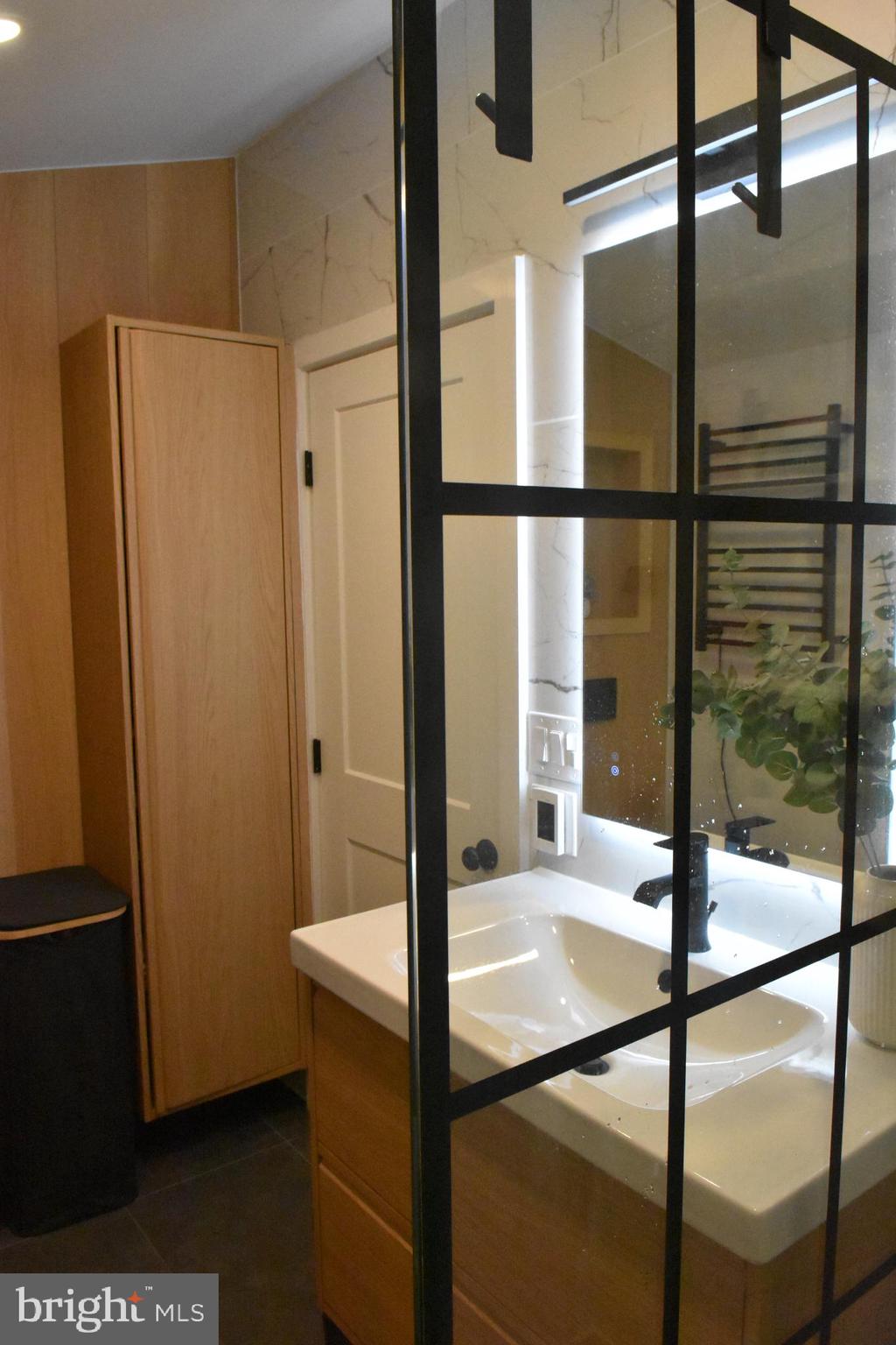 28 Delaware Avenue Ewing, NJ 08628 - Photo 23 of 46 a bathroom with a glass shower door