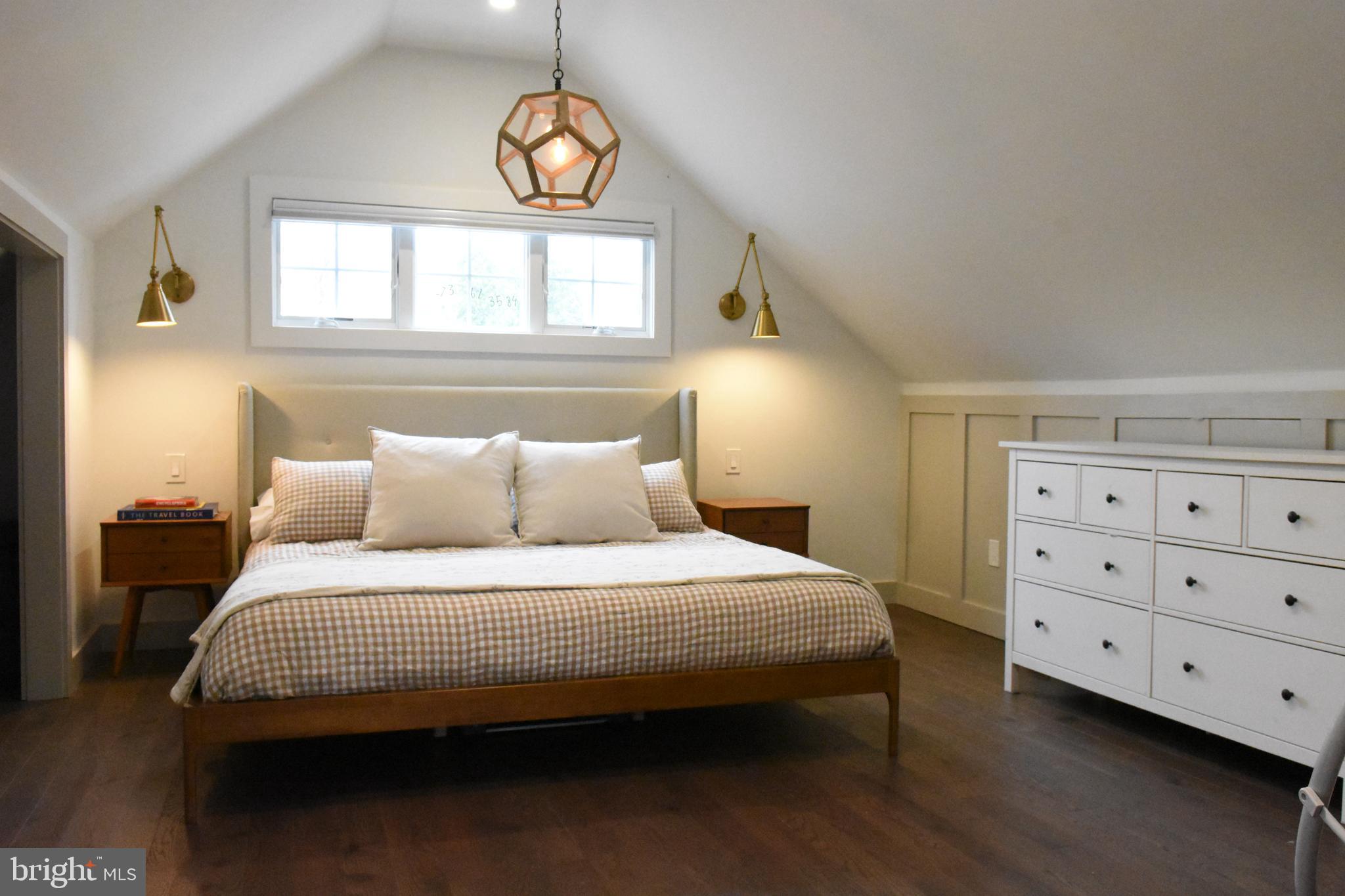 28 Delaware Avenue Ewing, NJ 08628 - Photo 25 of 46 a bedroom with a bed a dresser and a window