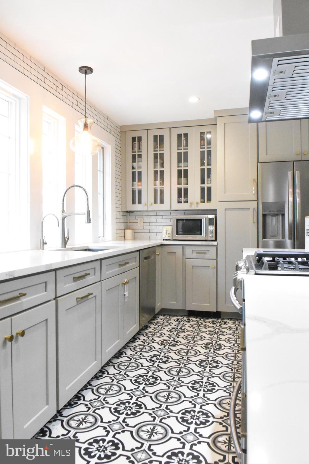 28 Delaware Avenue Ewing, NJ 08628 - Photo 32 of 46 a kitchen with a refrigerator and a sink