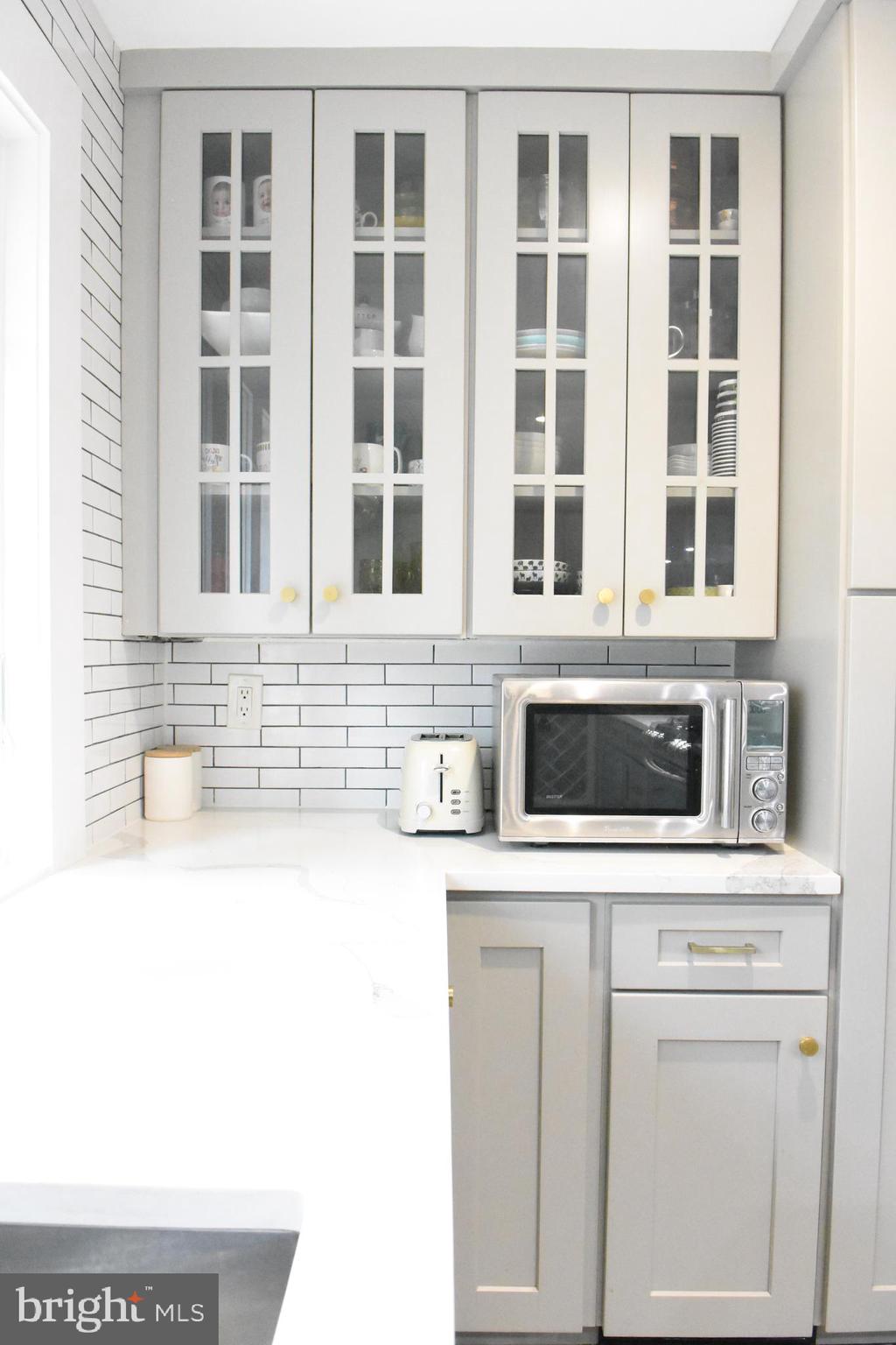 28 Delaware Avenue Ewing, NJ 08628 - Photo 35 of 46 a view of a kitchen sink and a microwave