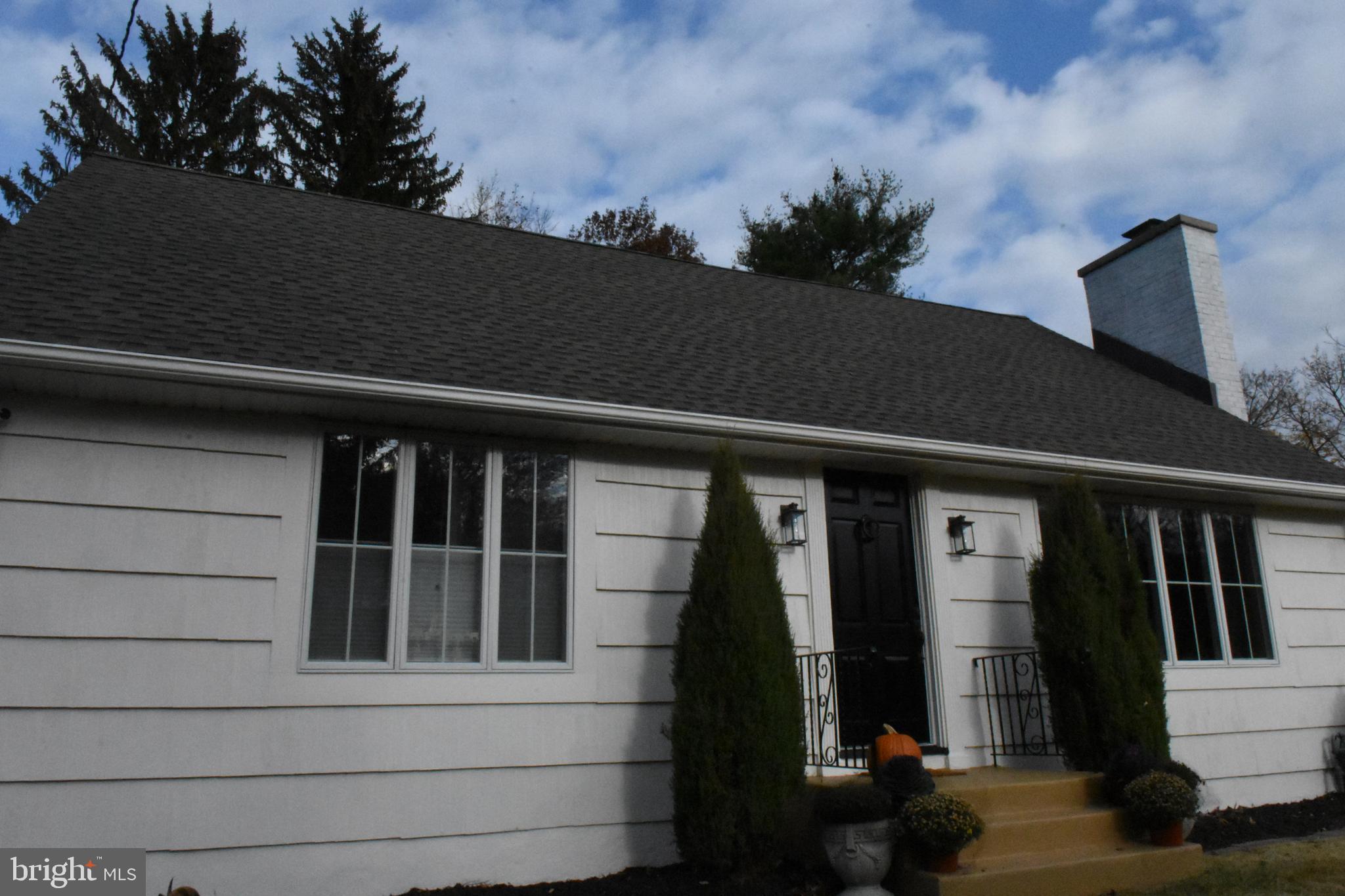 28 Delaware Avenue Ewing, NJ 08628 - Photo 44 of 46 a front view of a house with a garden