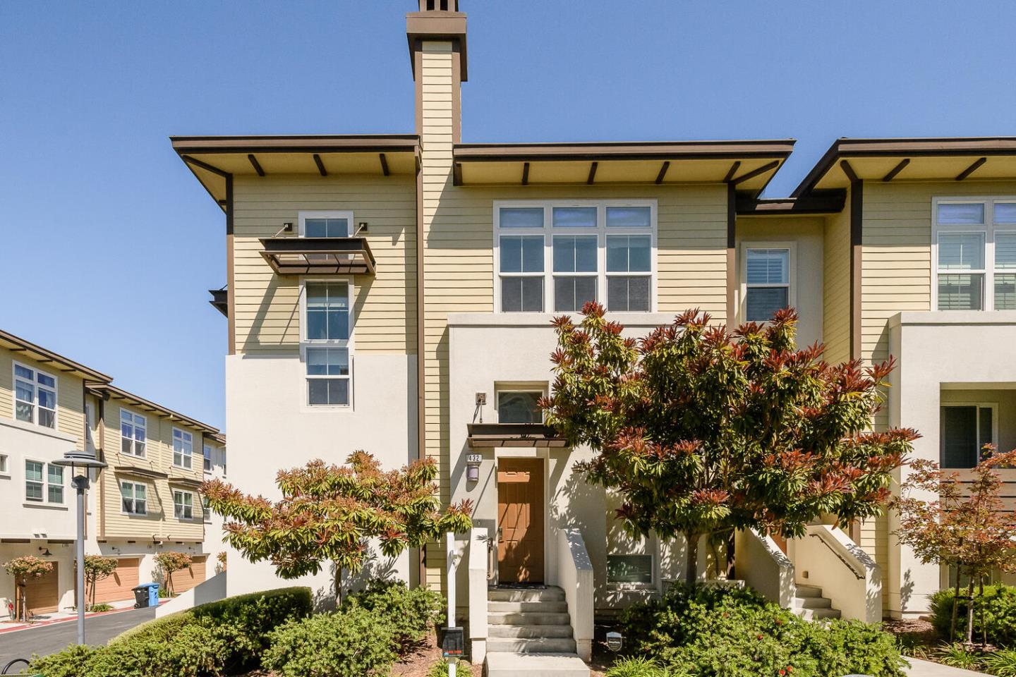 a front view of a house with a yard