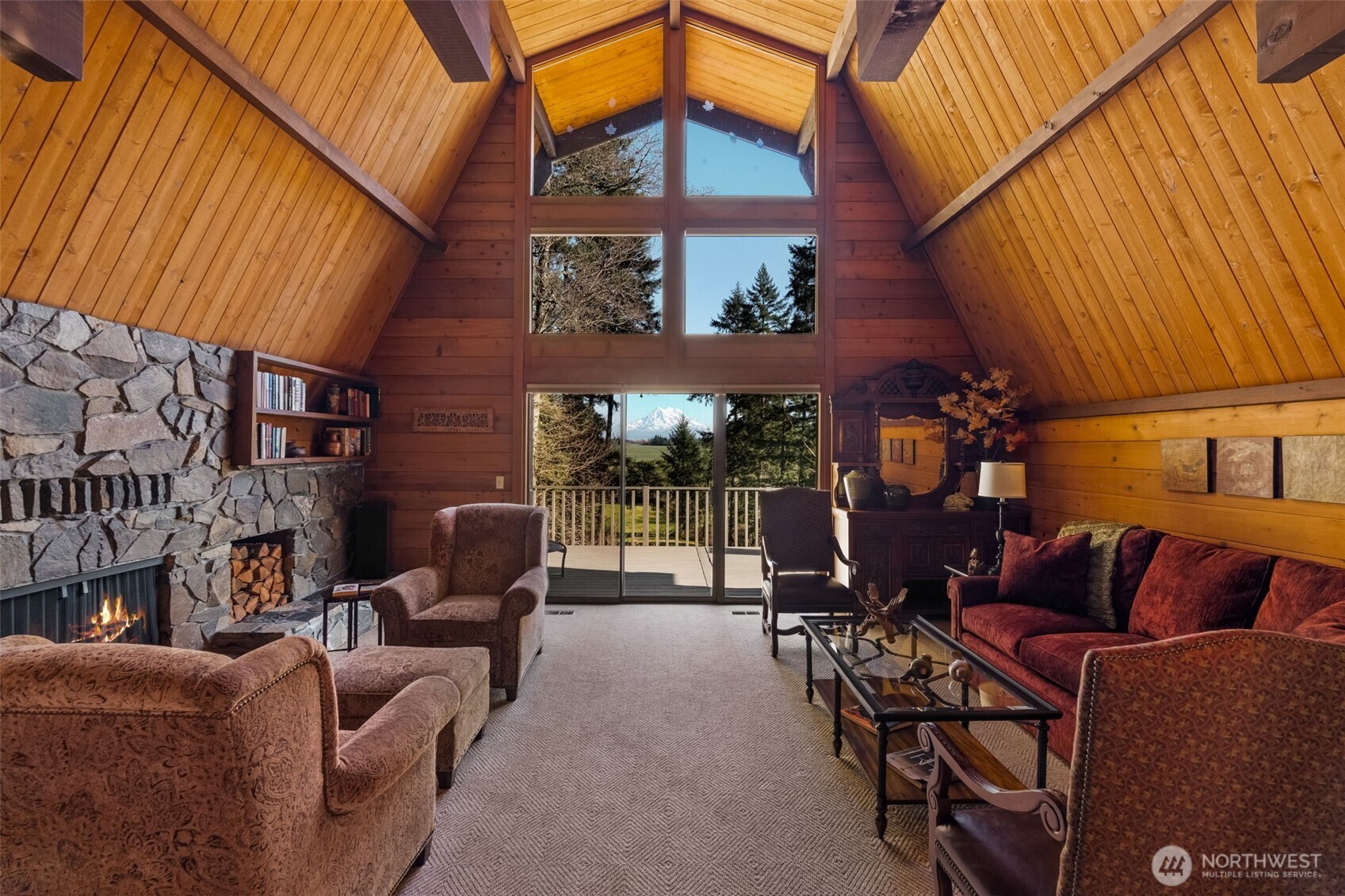 29622 48th Avenue South Roy, WA 98580 - Photo 12 of 38 a view of a patio with couches table and chairs under an umbrella