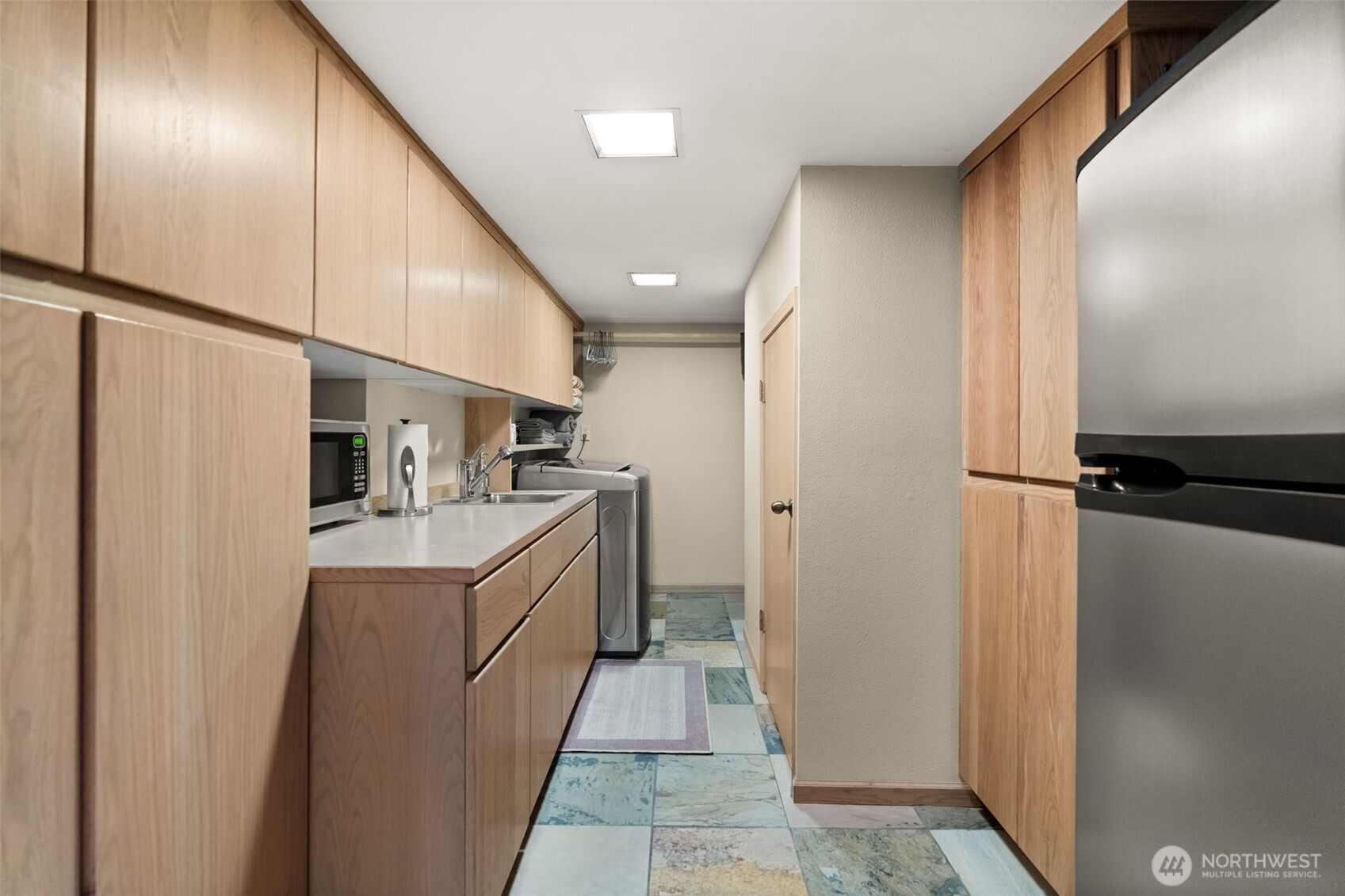 29622 48th Avenue South Roy, WA 98580 - Photo 27 of 38 a kitchen with refrigerator and cabinets