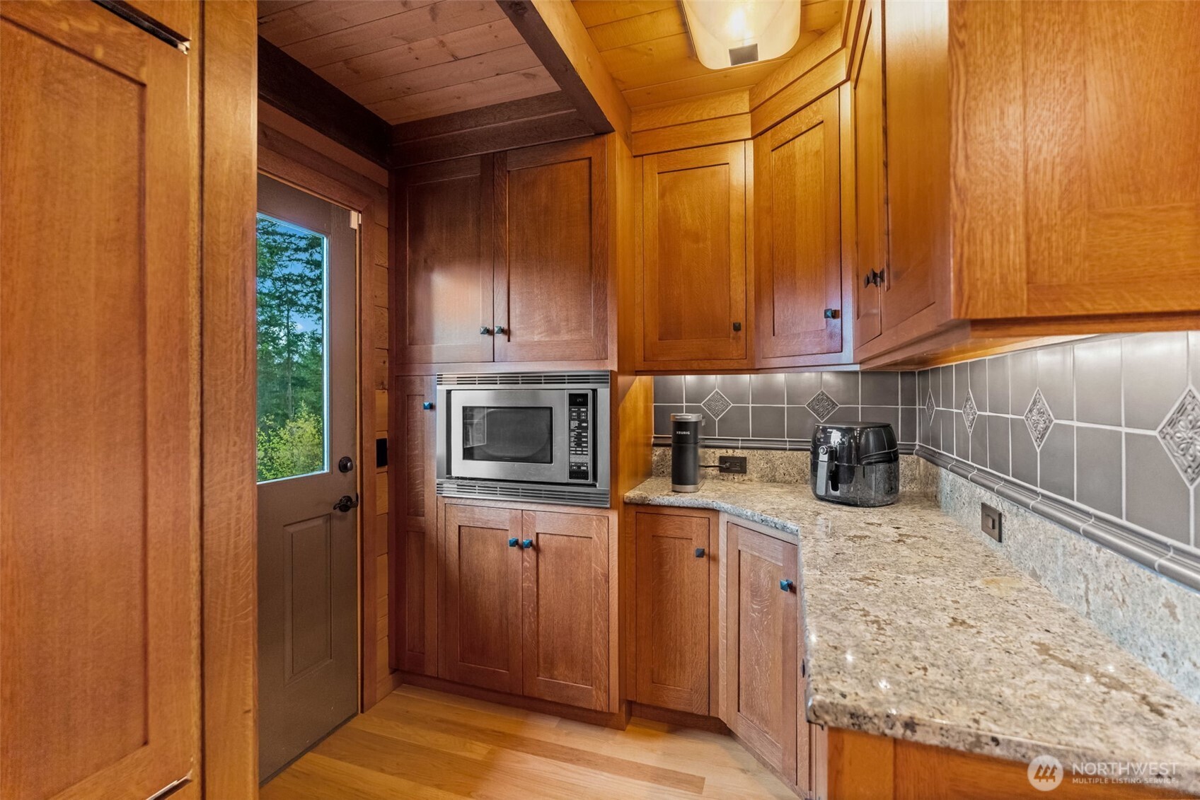 29622 48th Avenue South Roy, WA 98580 - Photo 9 of 38 a kitchen with a sink cabinets and appliances