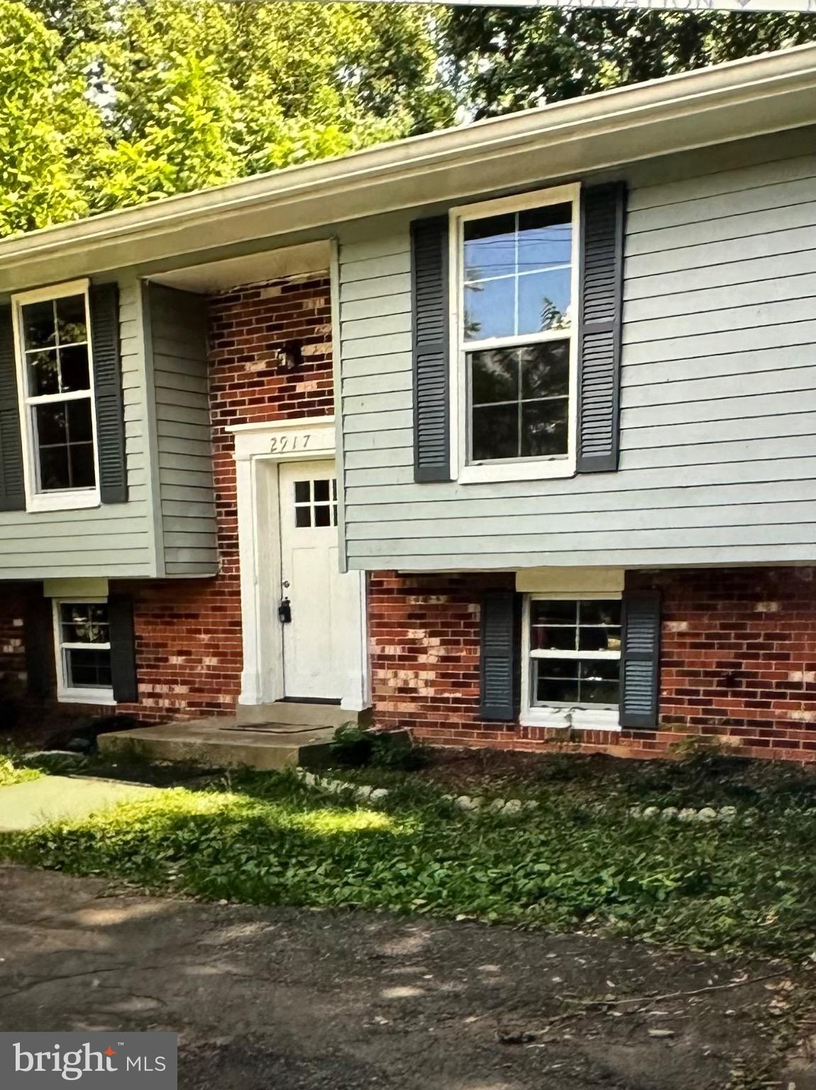 Charming split-level home with lush greenery.