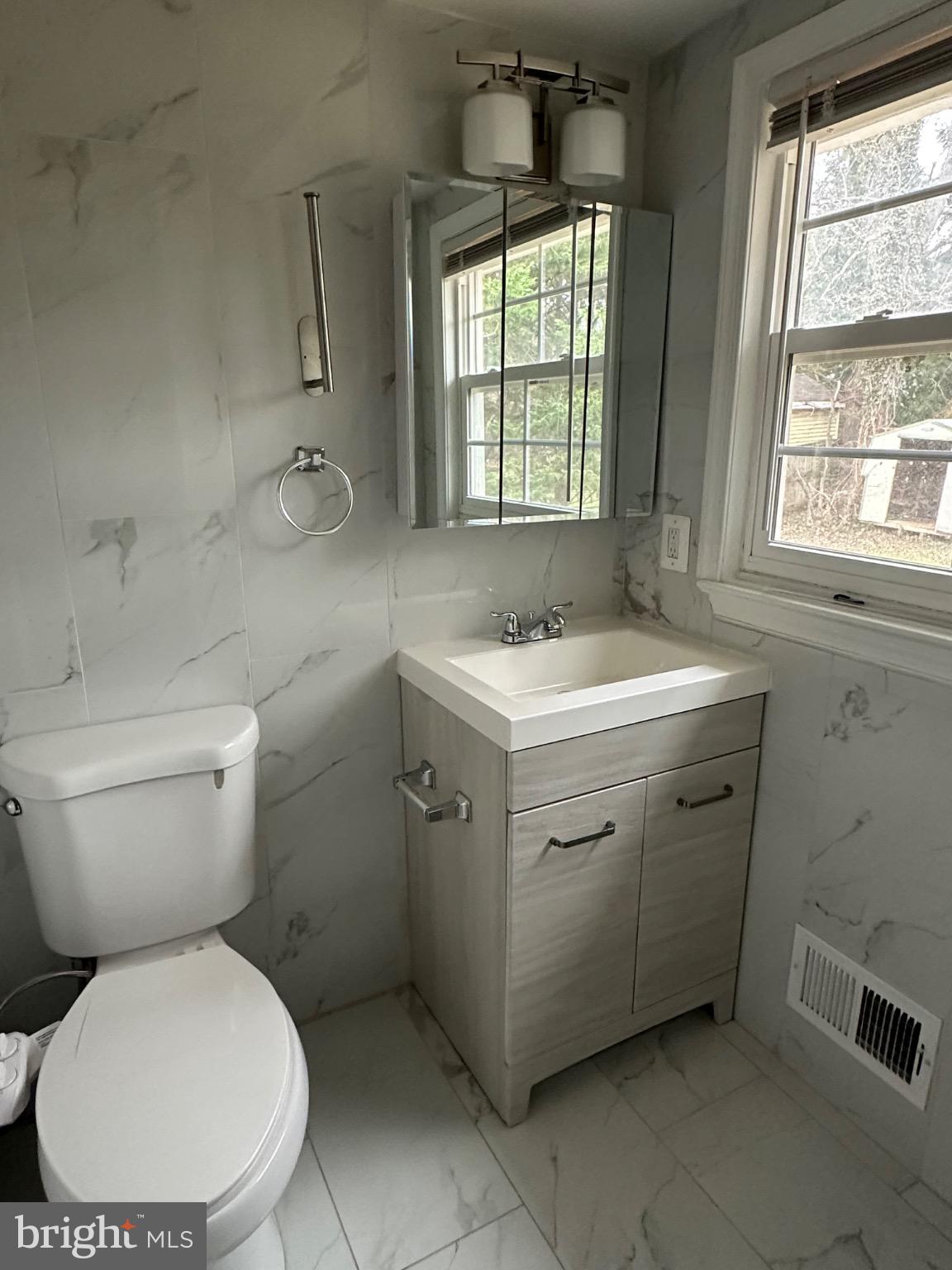 2917 Chain Bridge Road Oakton, VA 22124 - Photo 5 of 11 Modern bathroom with elegant marble accents.