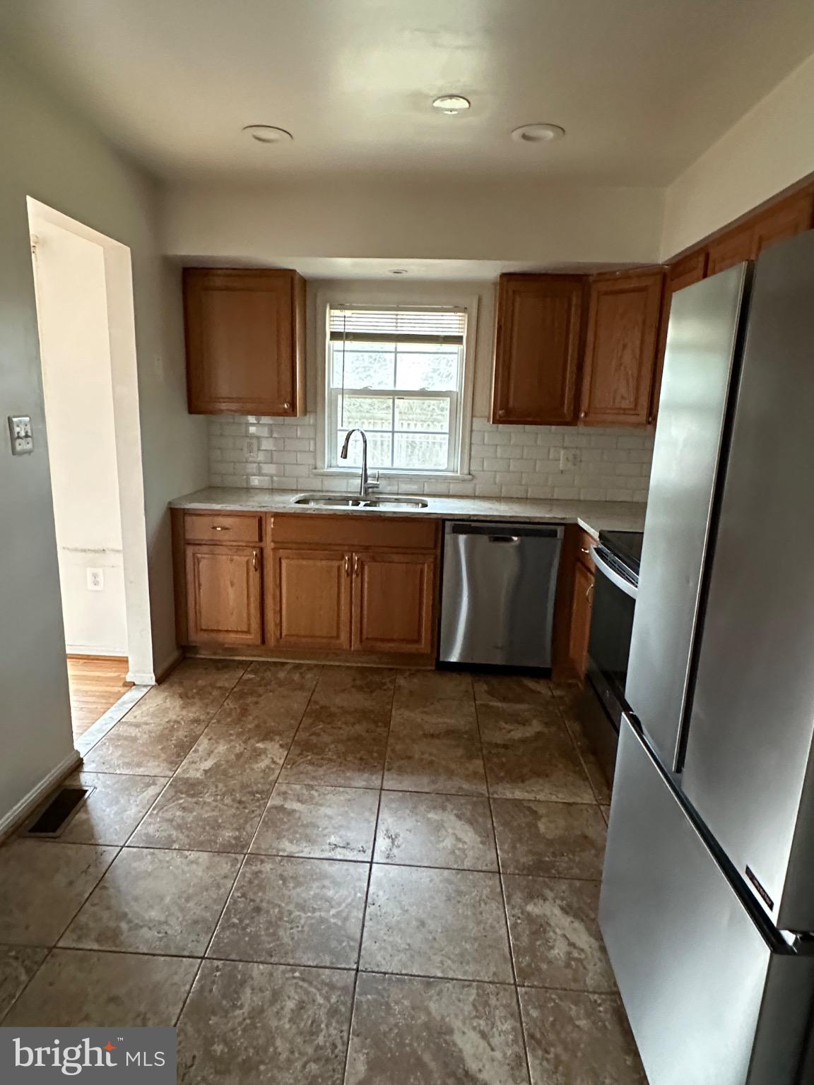 2917 Chain Bridge Road Oakton, VA 22124 - Photo 7 of 11 Bright and inviting kitchen space.