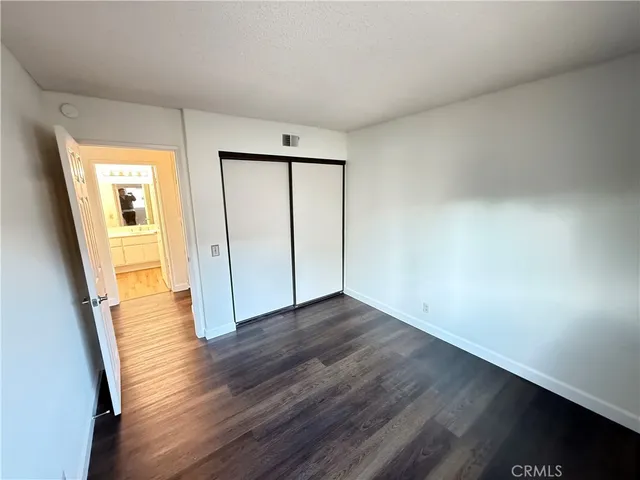 a view of kitchen and wooden floor