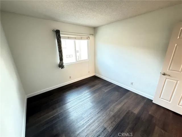 a view of livingroom with hardwood floor and a ceiling fan