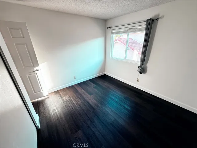 a spacious bathroom with a tub a sink and a large mirror