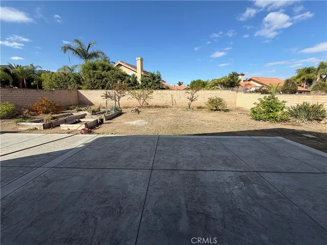 a view of a white house with a yard