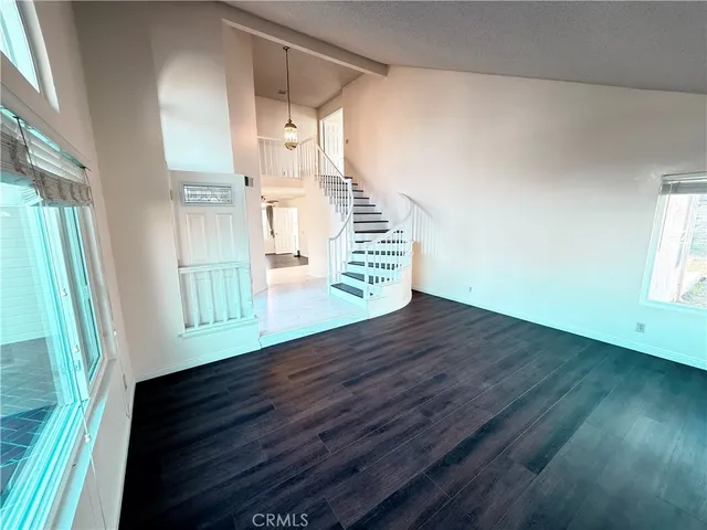 a view of entryway with wooden floor