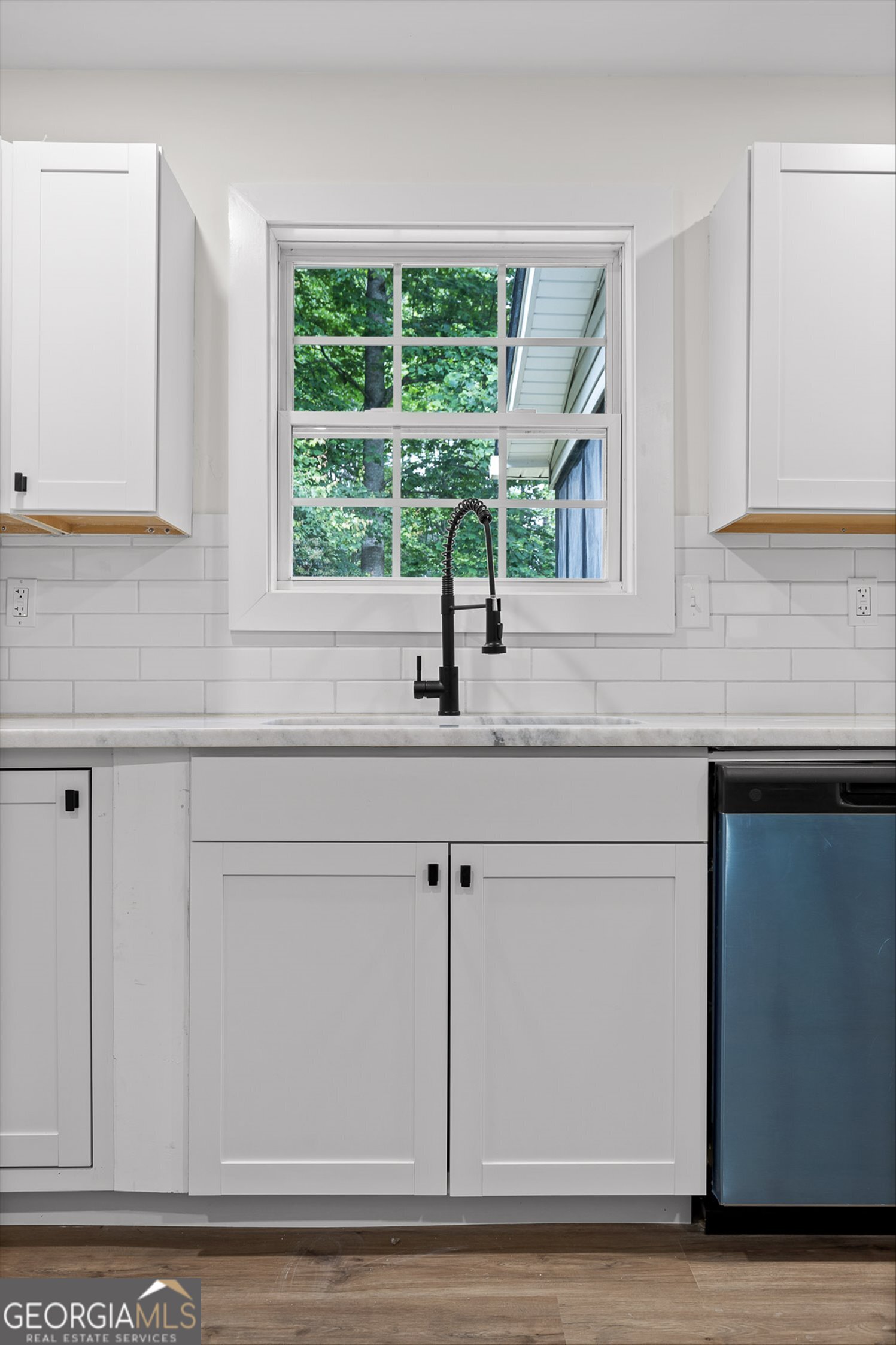 506 Condra Road Ringgold, GA 30736 - Photo 11 of 27 a kitchen with granite countertop white cabinets and a window