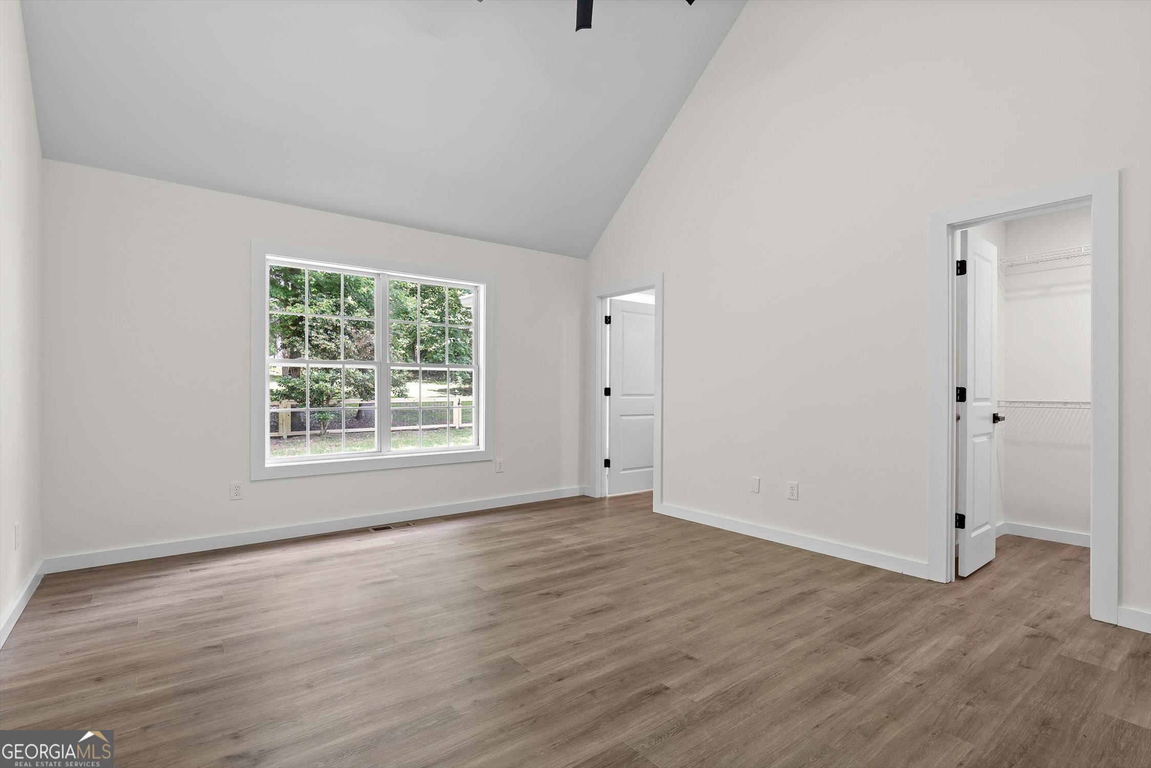 506 Condra Road Ringgold, GA 30736 - Photo 15 of 27 a view of an empty room with wooden floor and a window
