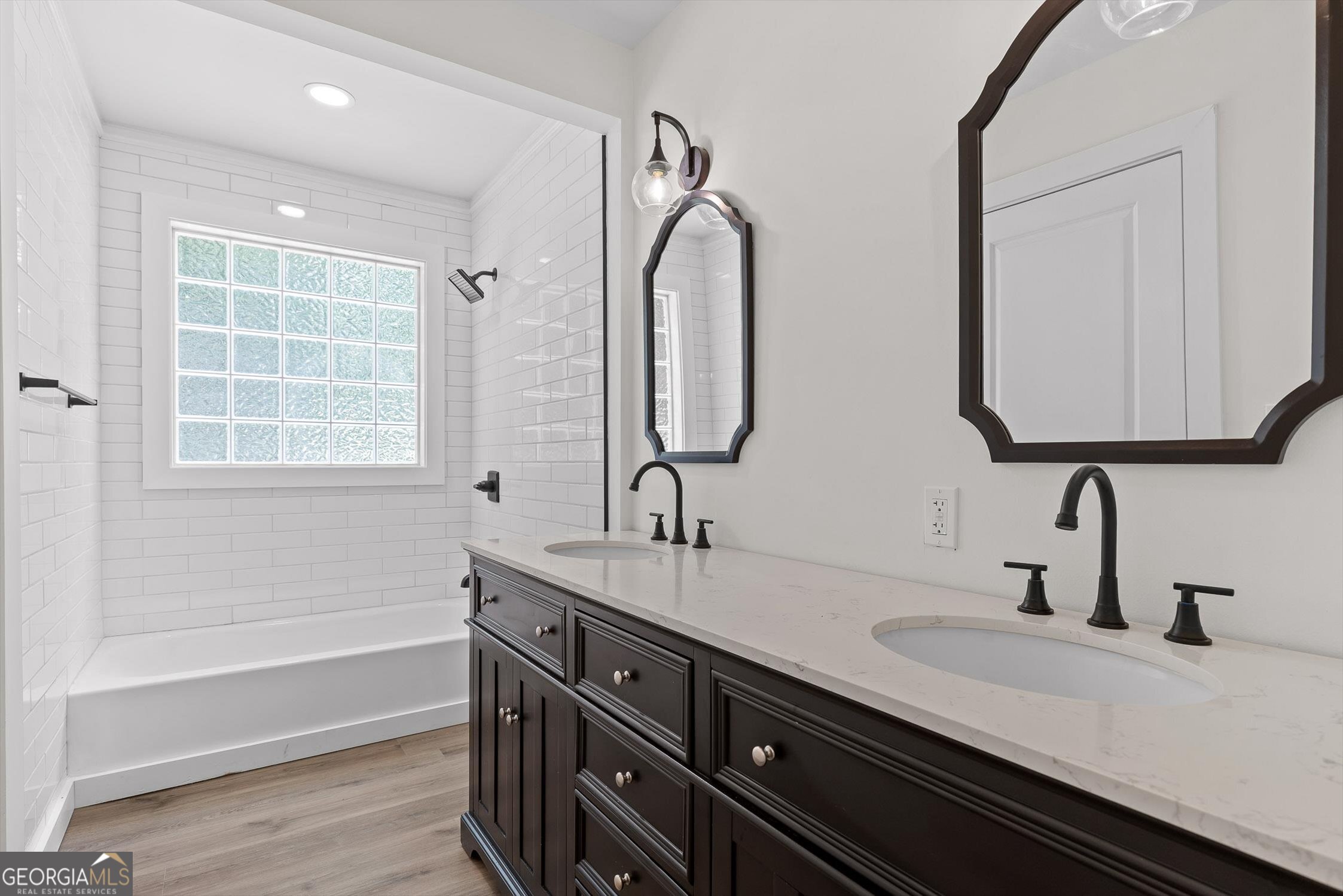 506 Condra Road Ringgold, GA 30736 - Photo 16 of 27 a bathroom with a double vanity sink and a mirror