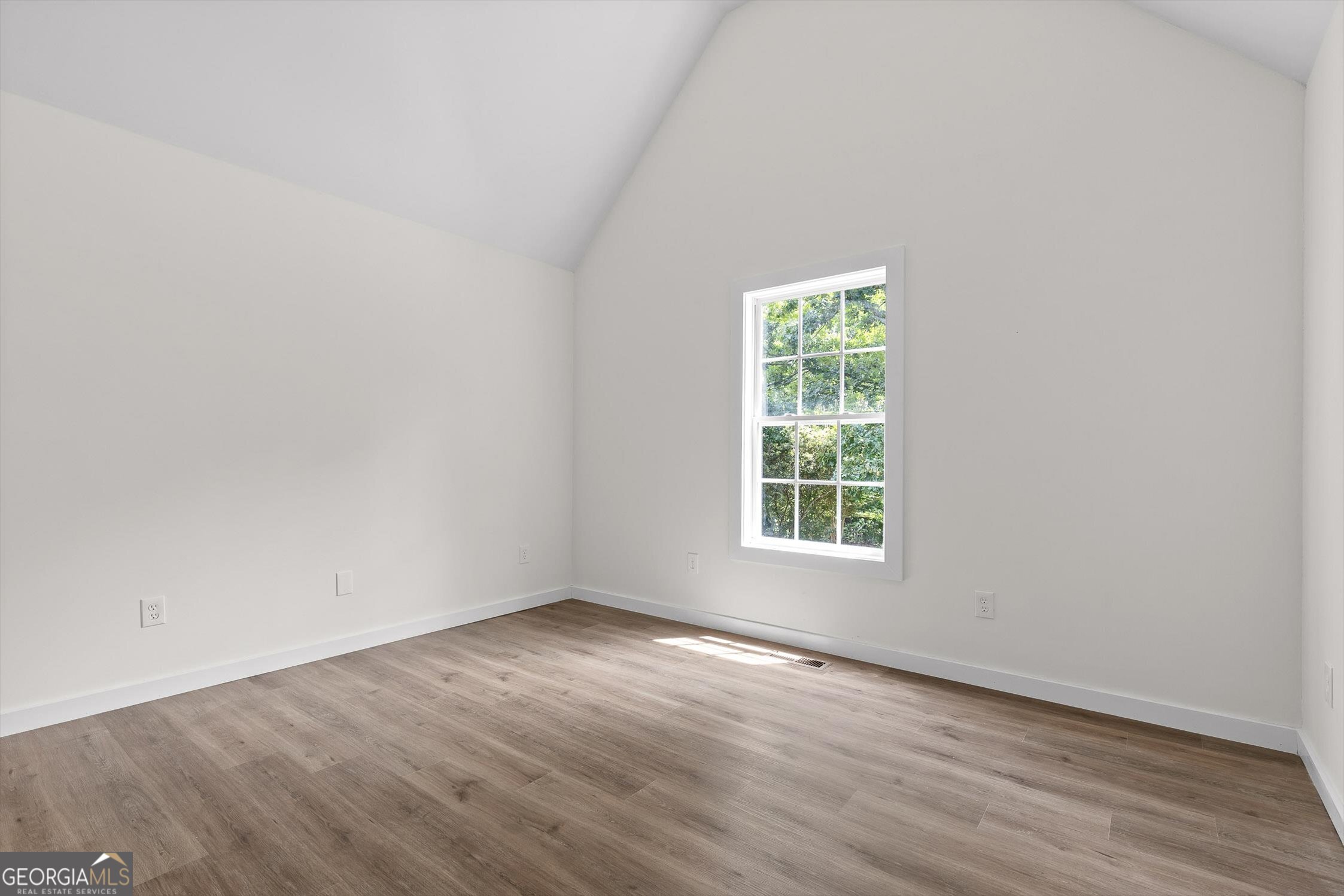 506 Condra Road Ringgold, GA 30736 - Photo 20 of 27 a view of an empty room with wooden floor and a window