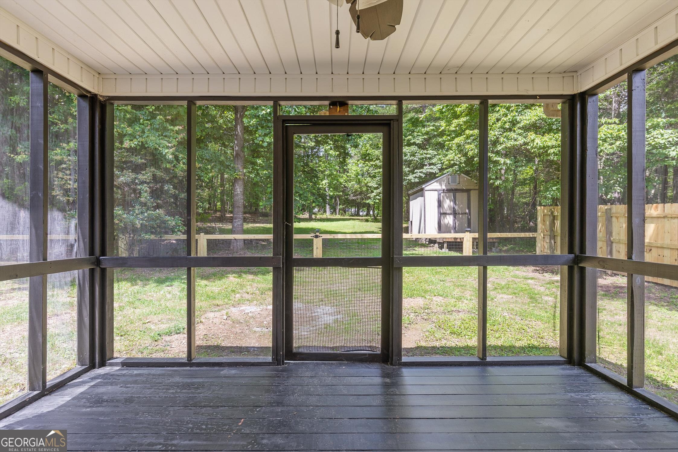 506 Condra Road Ringgold, GA 30736 - Photo 2 of 27 a view of an empty room with wooden floor and a large window