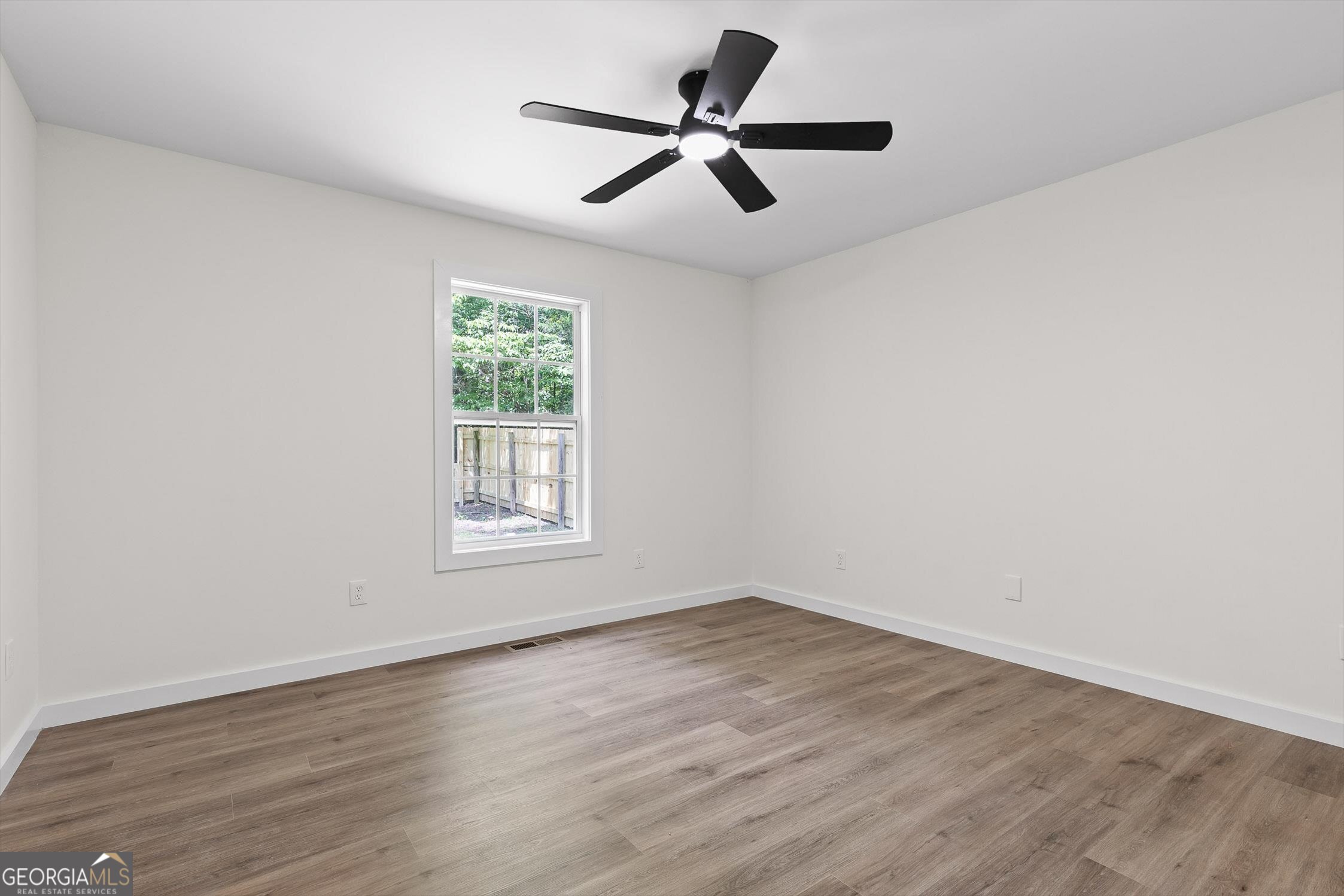 506 Condra Road Ringgold, GA 30736 - Photo 21 of 27 a view of empty room with wooden floor and window