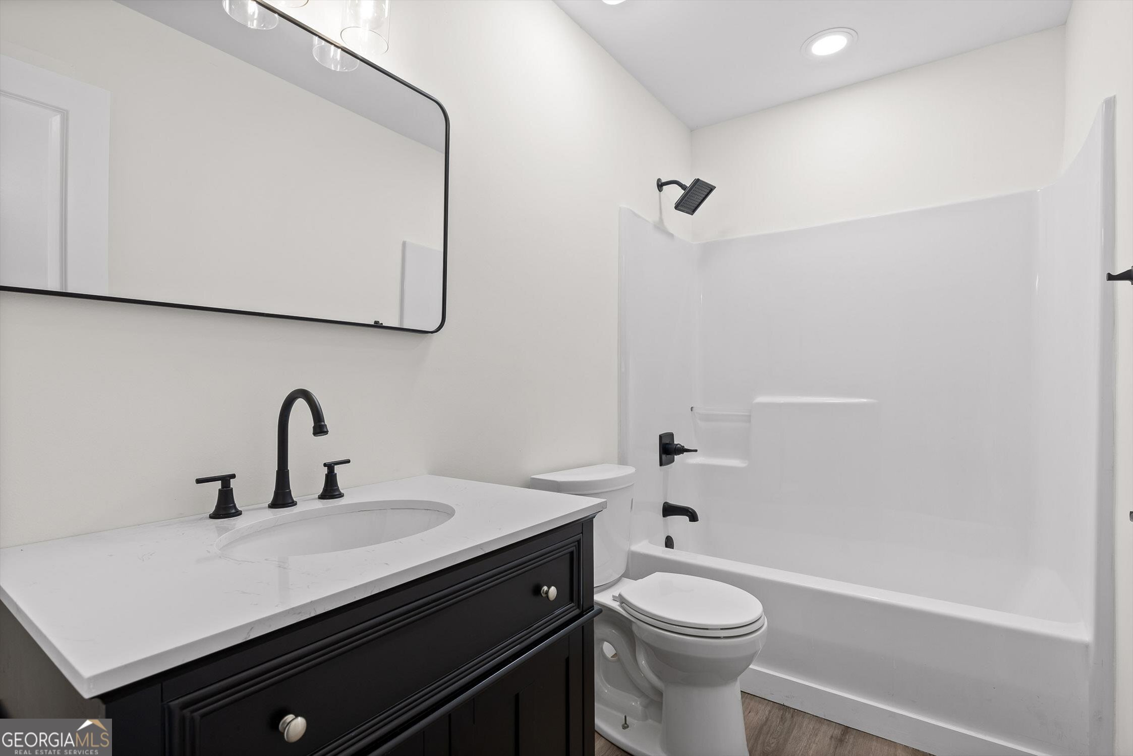 506 Condra Road Ringgold, GA 30736 - Photo 22 of 27 a bathroom with a sink a toilet and shower
