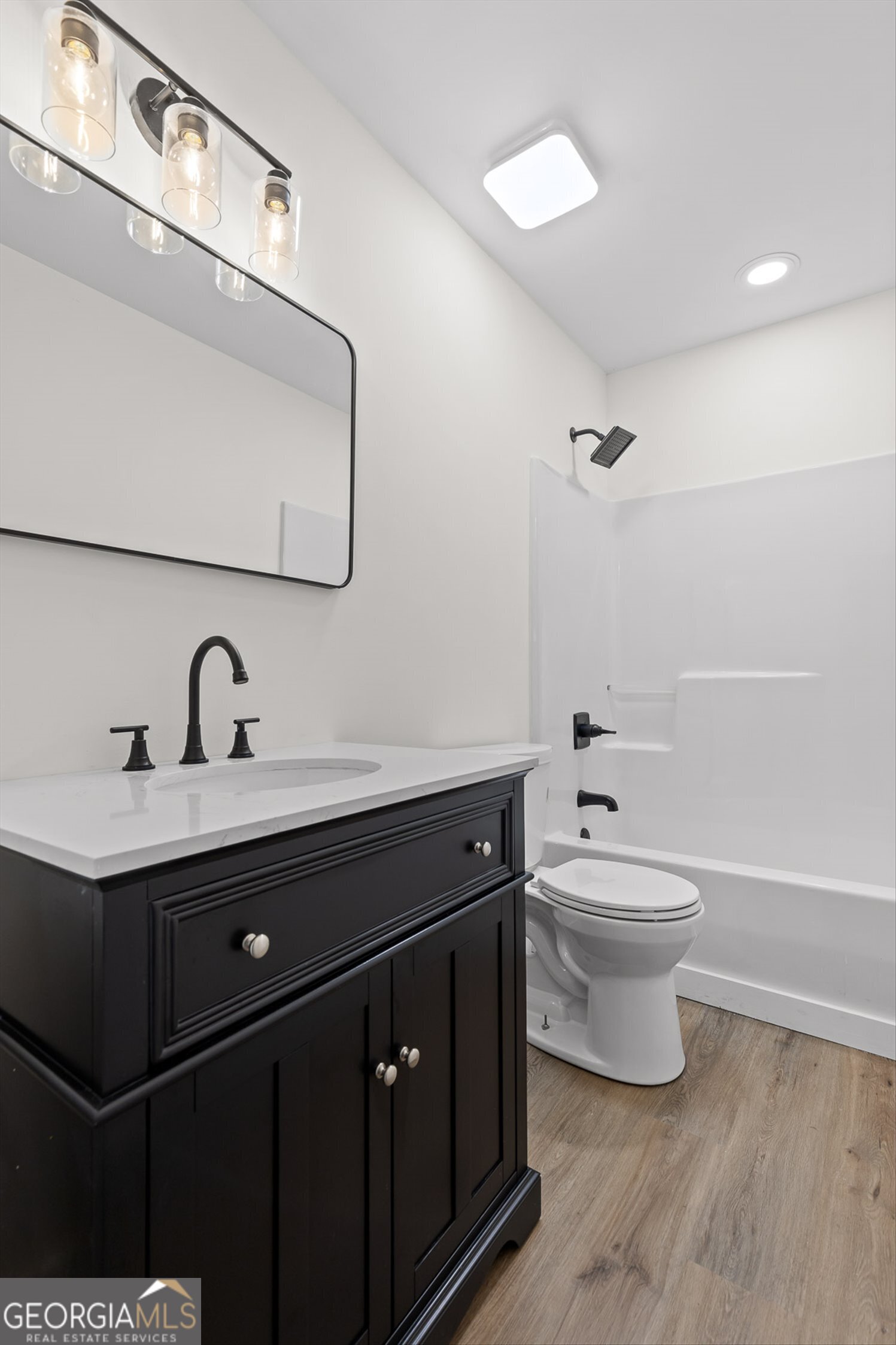 506 Condra Road Ringgold, GA 30736 - Photo 23 of 27 a bathroom with a toilet sink and mirror