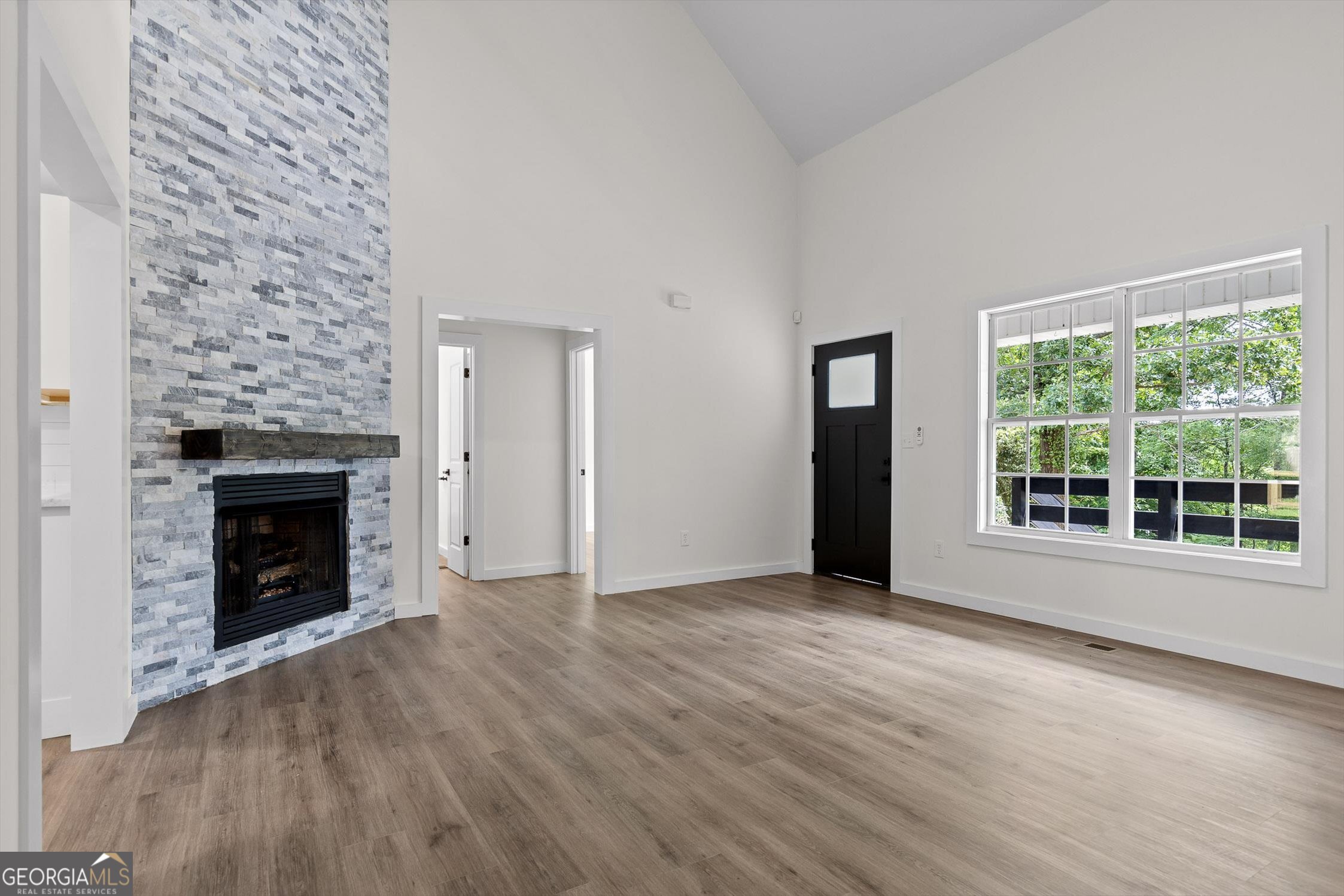506 Condra Road Ringgold, GA 30736 - Photo 5 of 27 wooden floor fireplace and windows in an empty room