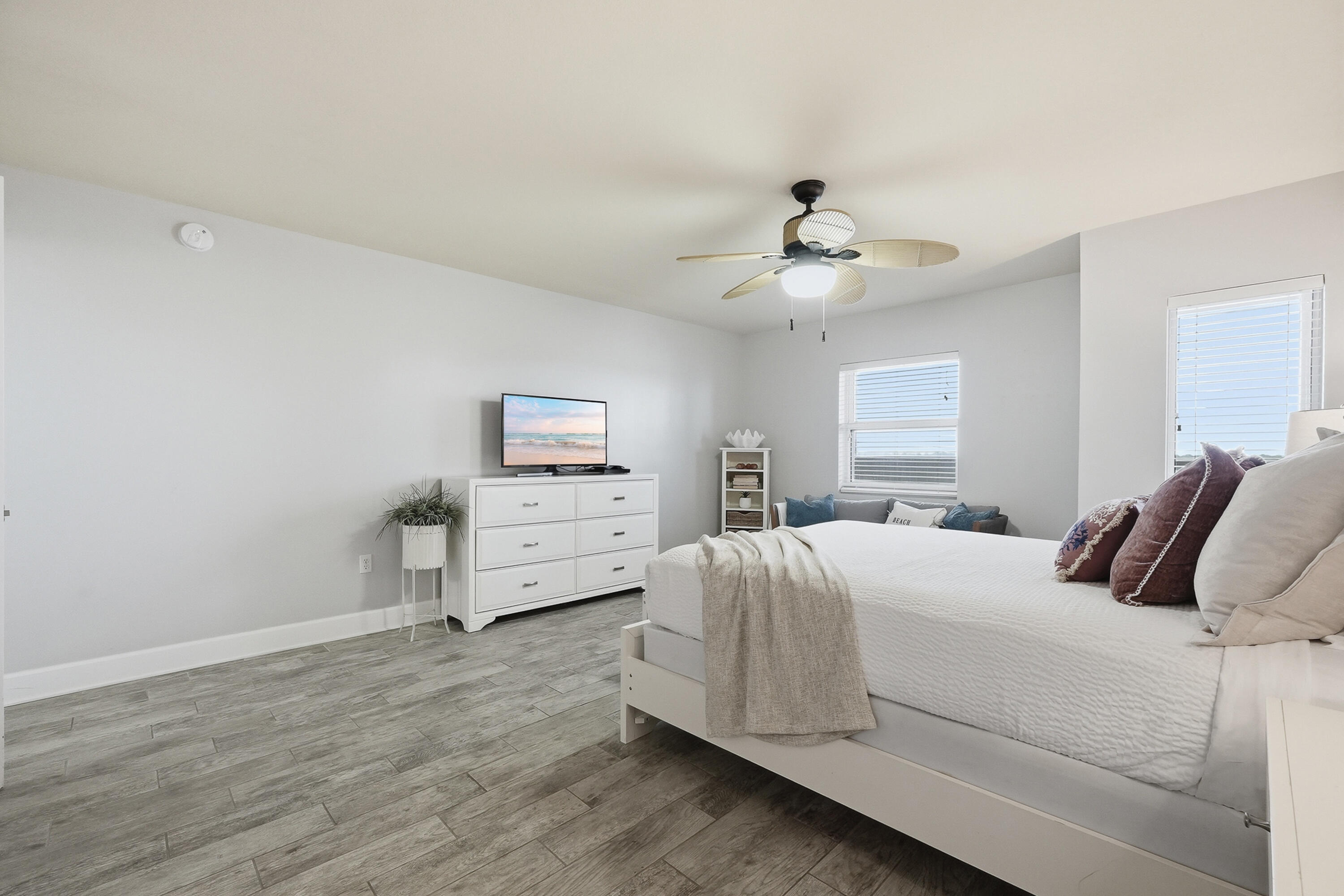 866 Santa Rosa Boulevard, Unit 506 Fort Walton Beach, FL 32548 - Photo 13 of 49 a bedroom with a bed and a chandelier