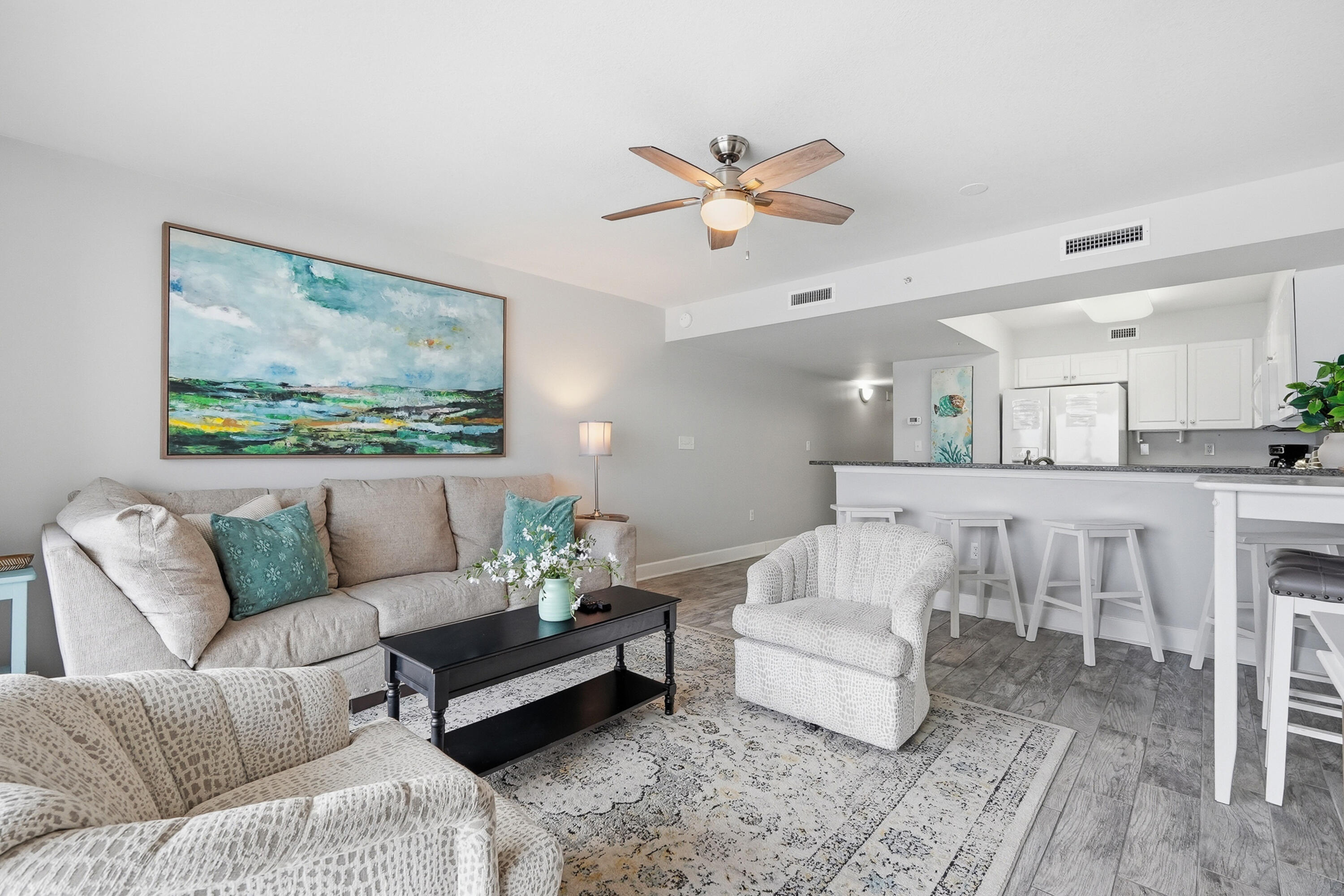 866 Santa Rosa Boulevard, Unit 506 Fort Walton Beach, FL 32548 - Photo 2 of 49 a living room with furniture and a painting on the wall